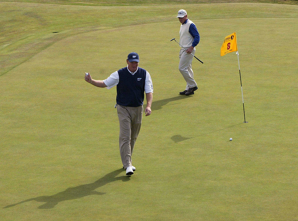 Ernie Els celebrates after sinking a hole-in-one at the Postage Stamp in 2004